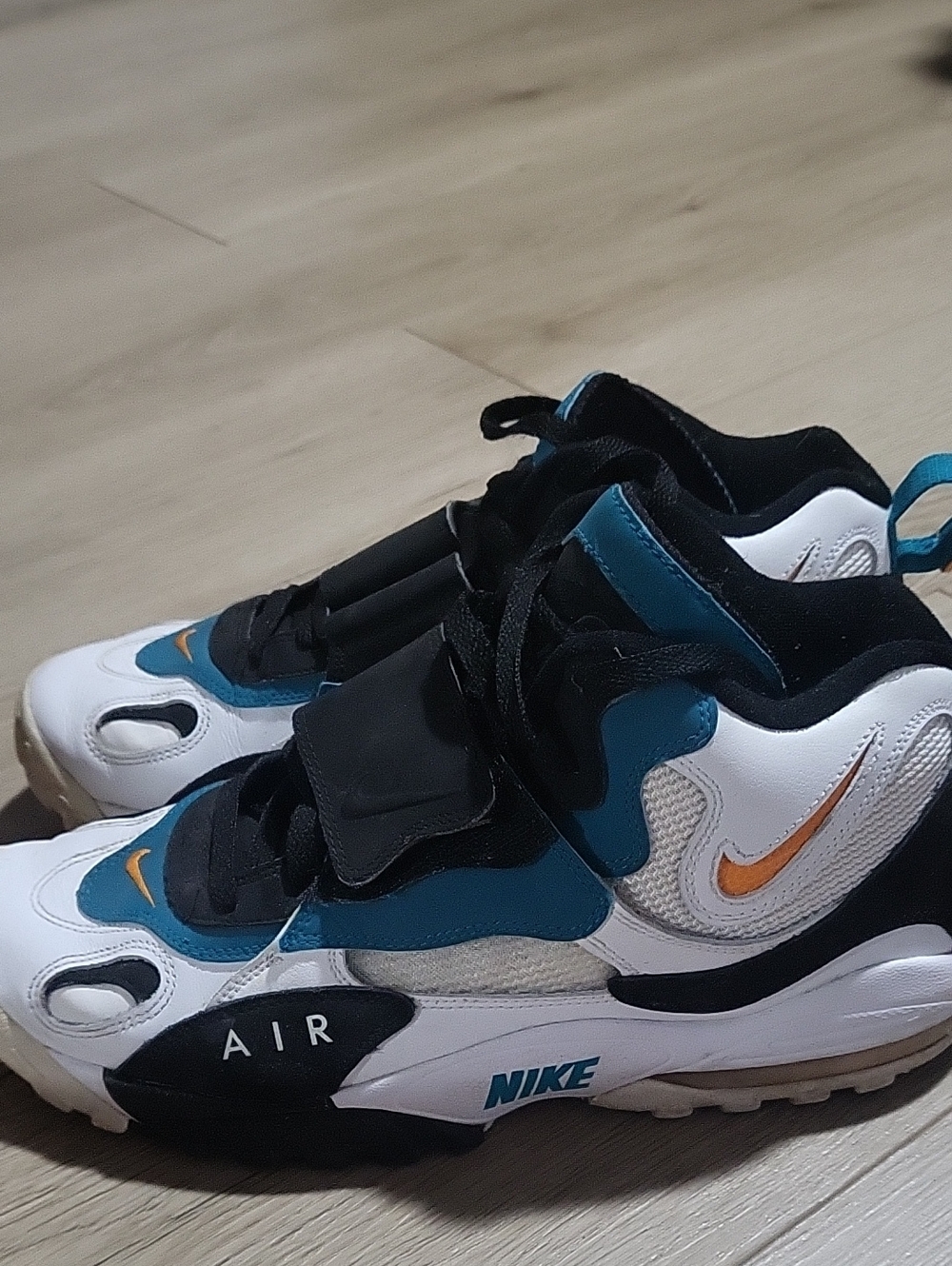 Nike Kids Air Mid-Top Sneakers in White, Teal & Black with Orange Swoosh